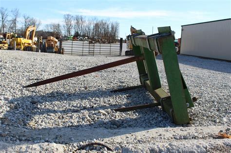 john deere skid steer in the hay|used john deere hay stacking equipment.